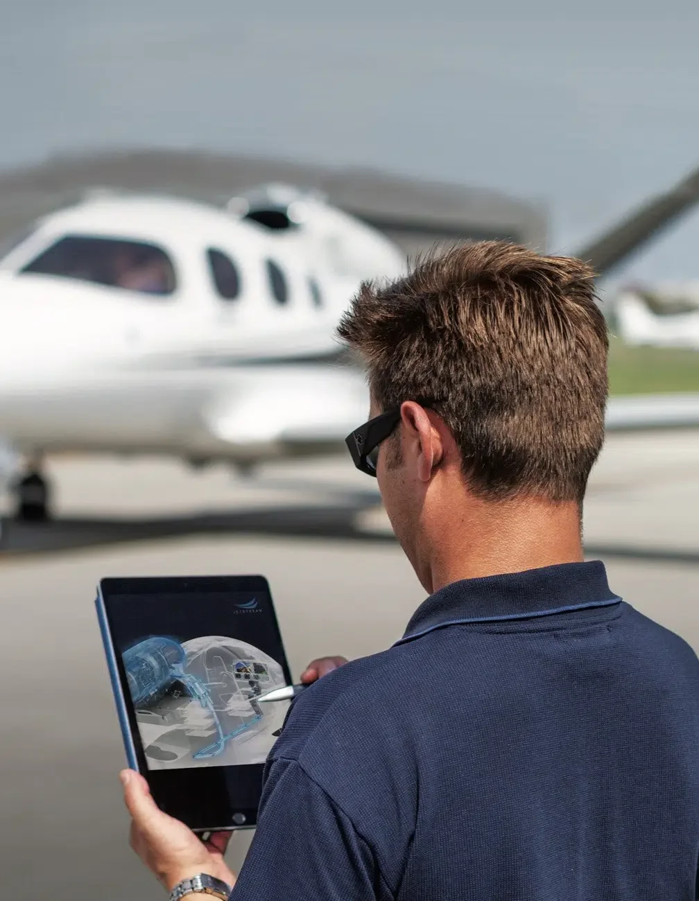 people shaking hands in front of cirrus jet